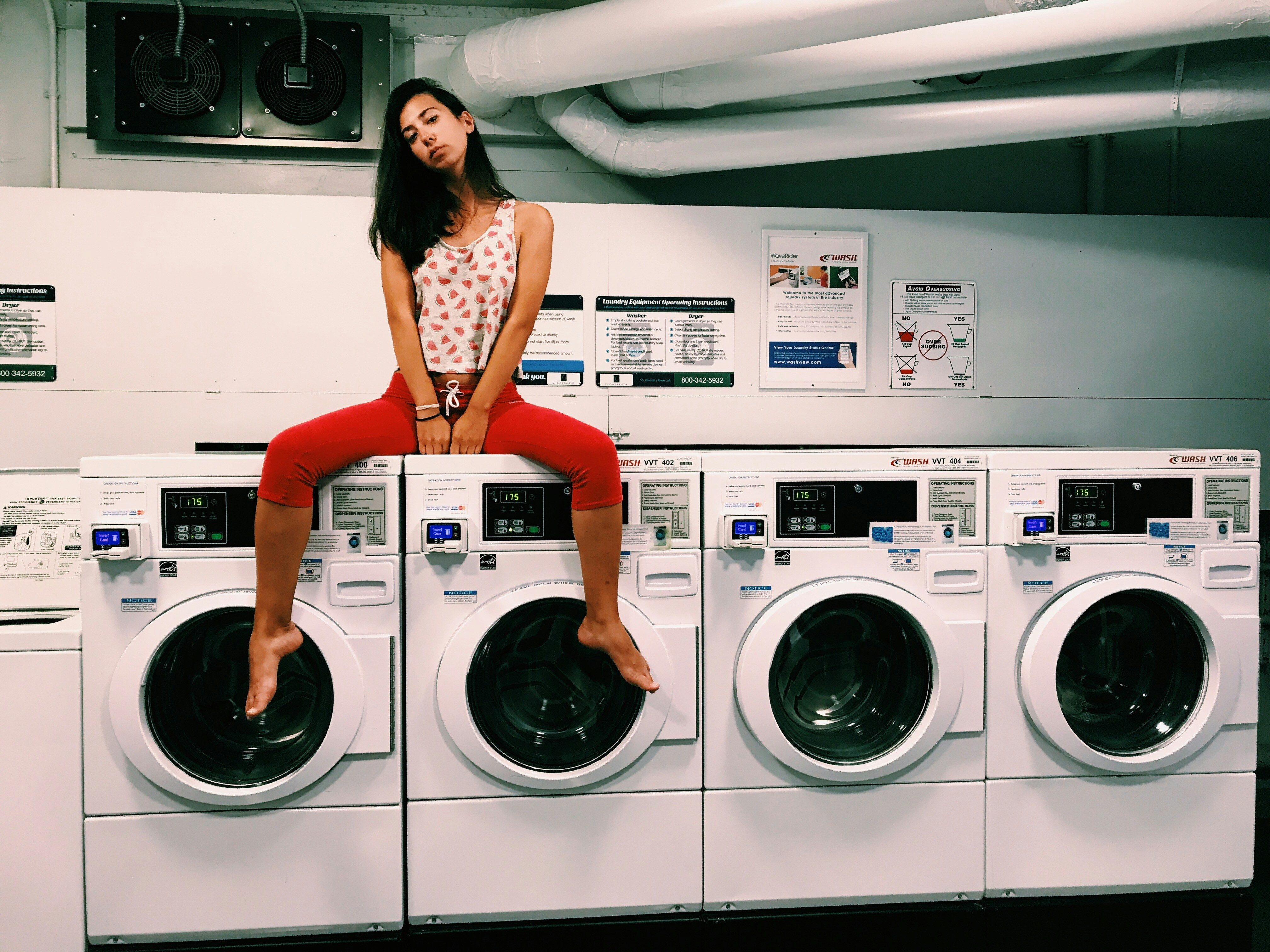 Girl Sitting On Washing Machine